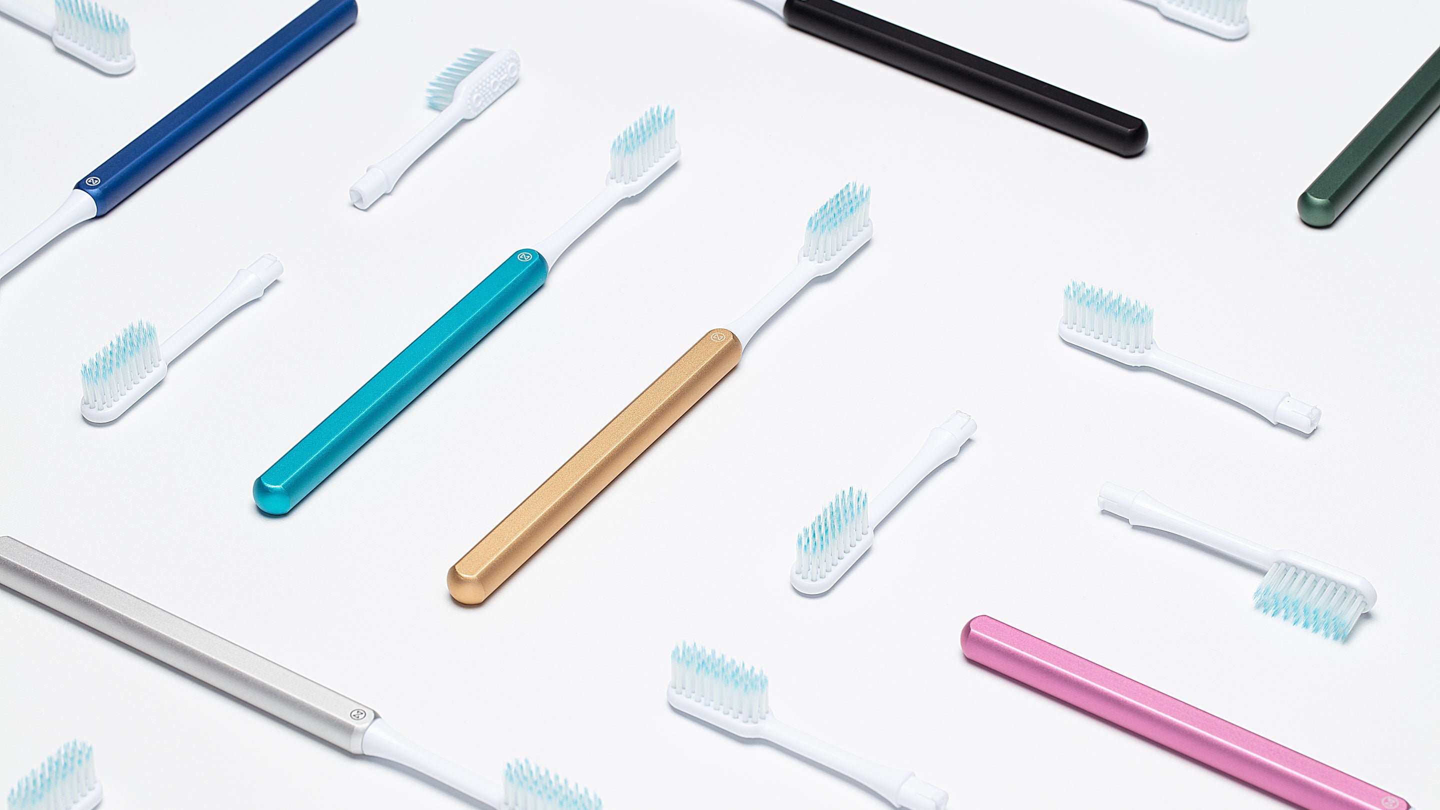 All colours of Nada sustainable toothbrushes with replacement toothbrush heads