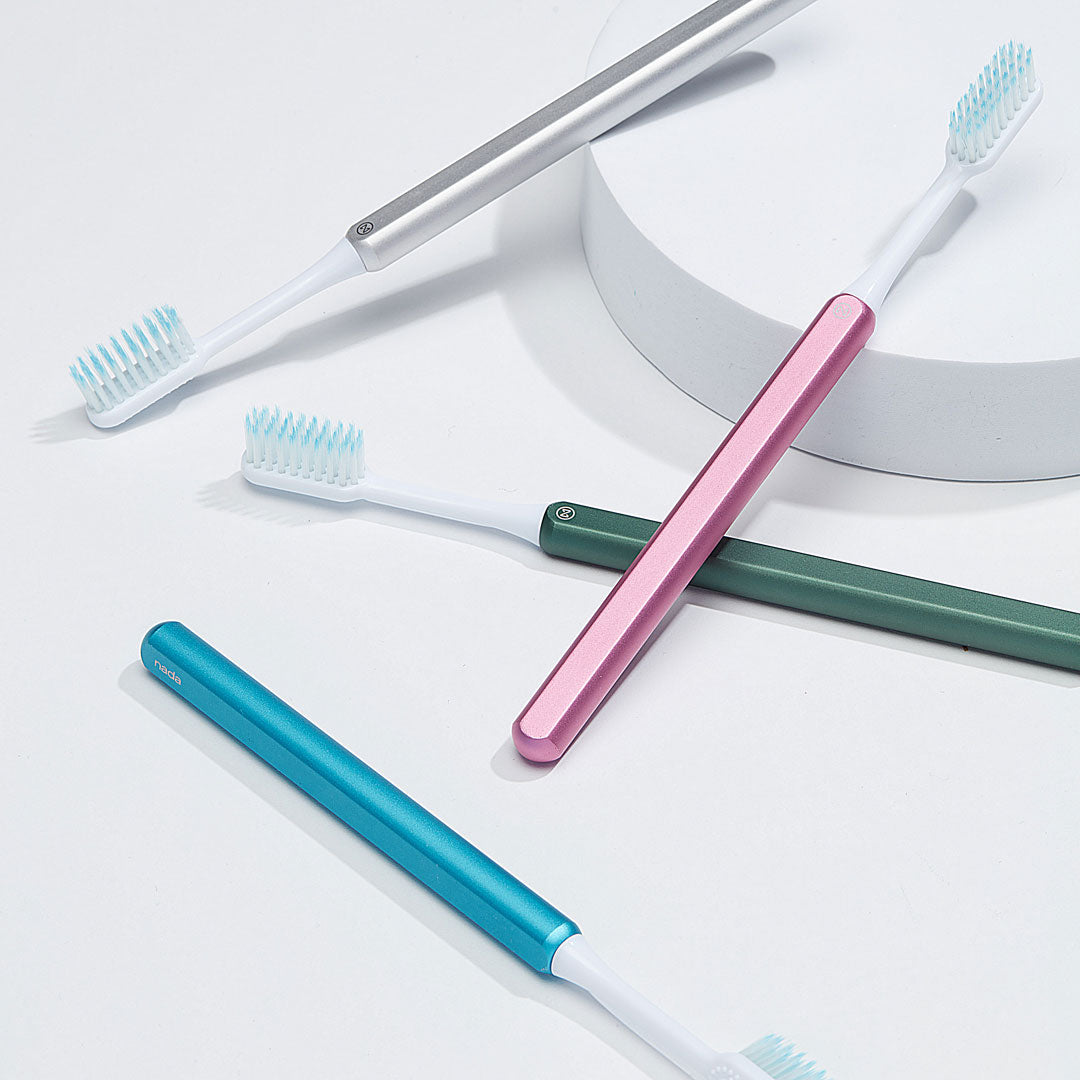 Eco-friendly Silver, Pink, Green and Arctic Blue Nada toothbrushes with recyclable brush heads