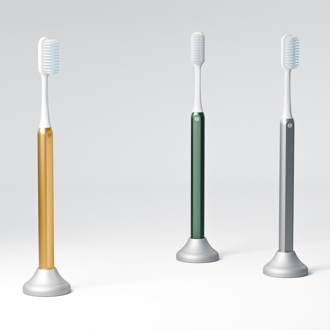 Gold, Green and Silver Nada Toothbrushes in Nada Aluminum Toothbrush Stands