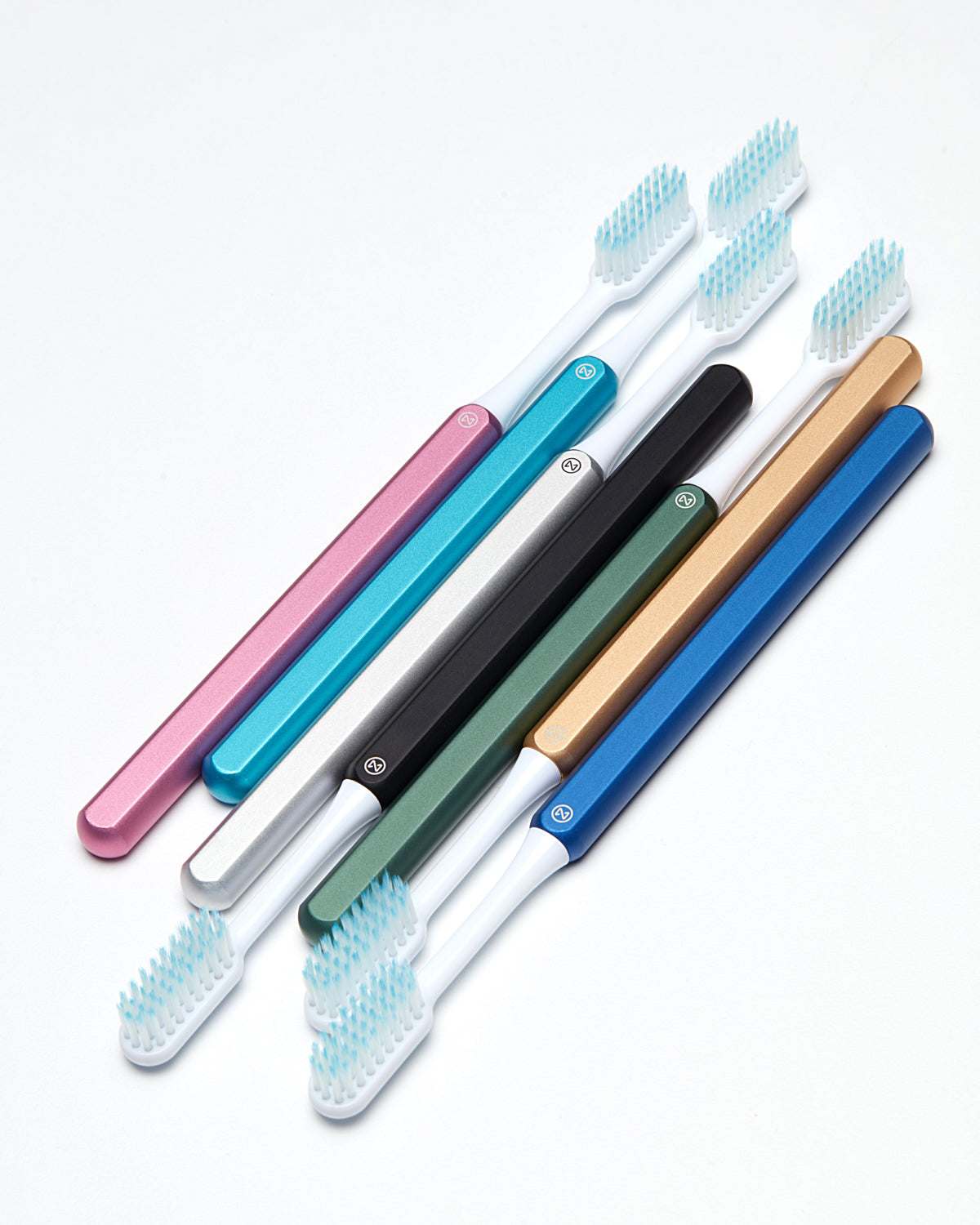 Sustainable Nada toothbrushes with aluminum handles and replacement toothbrush heads