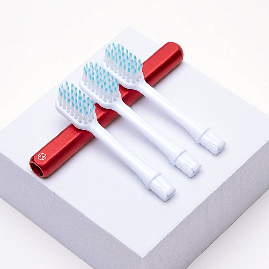 Eco-friendly kids red Nada toothbrush handle with 3 replacement brush heads
