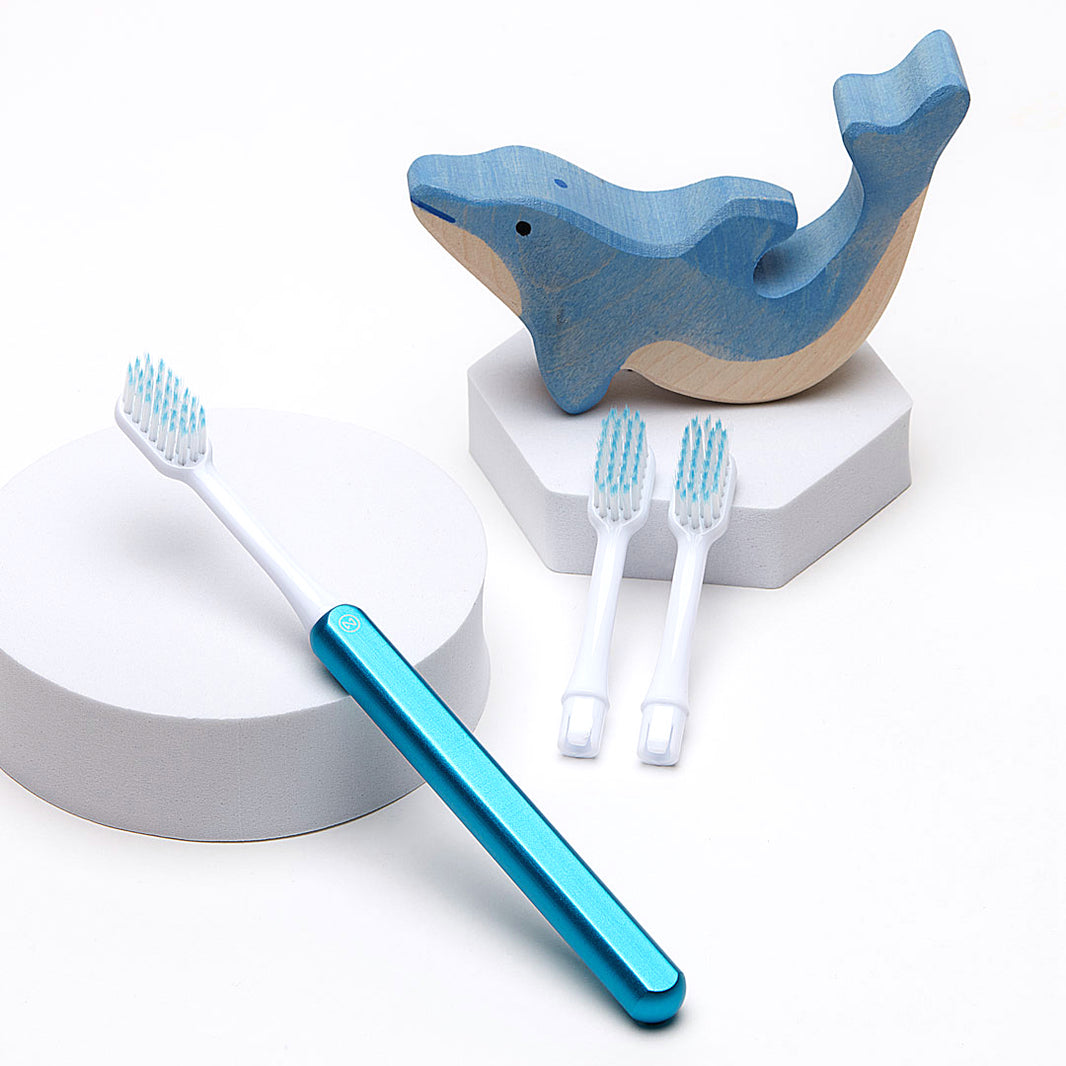 Nada Kids eco-friendly toothbrush with an aluminum handle and recyclable toothbrush heads