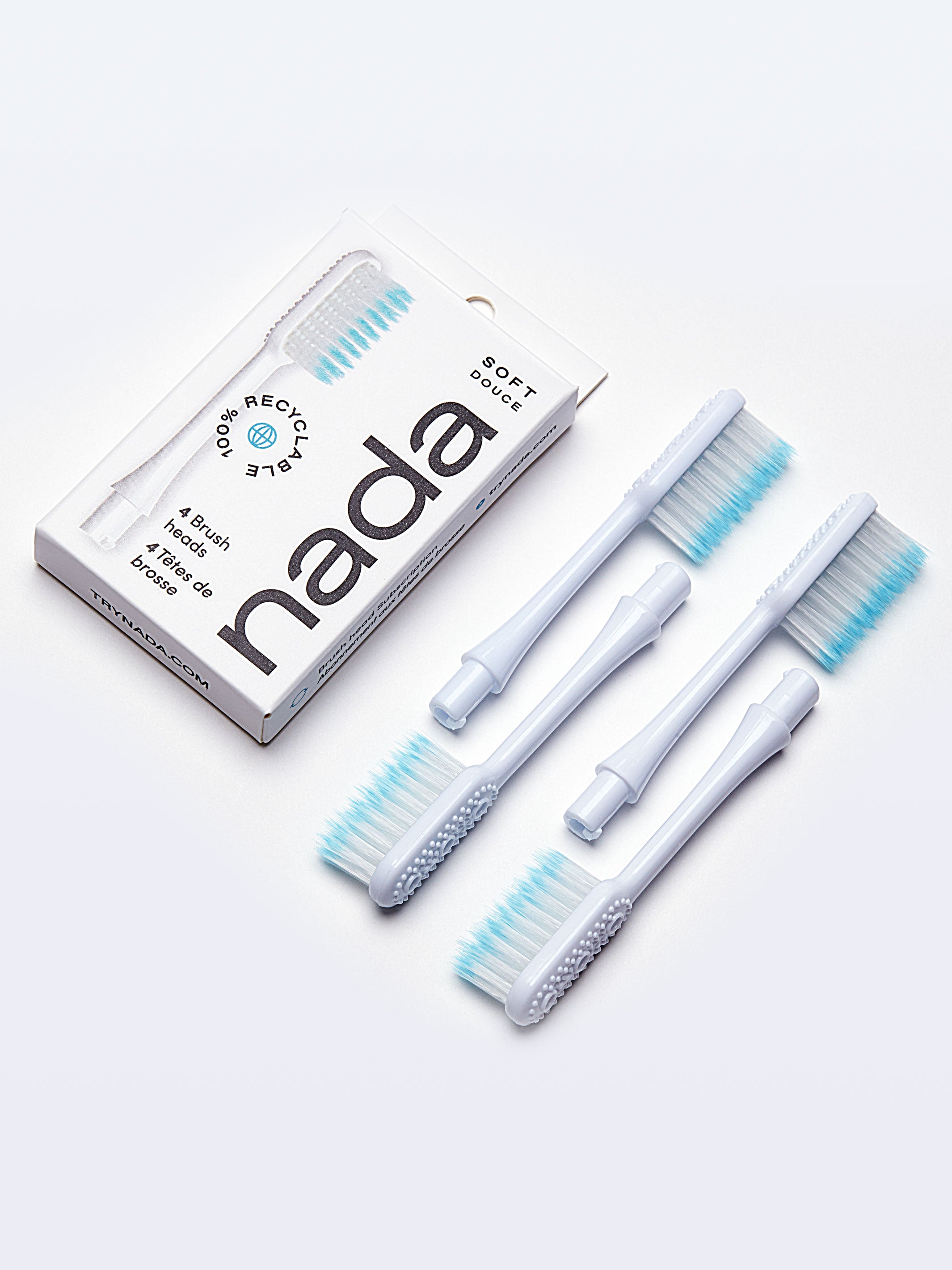 Photo of a Grin toothbrush and 2 wooden figurines