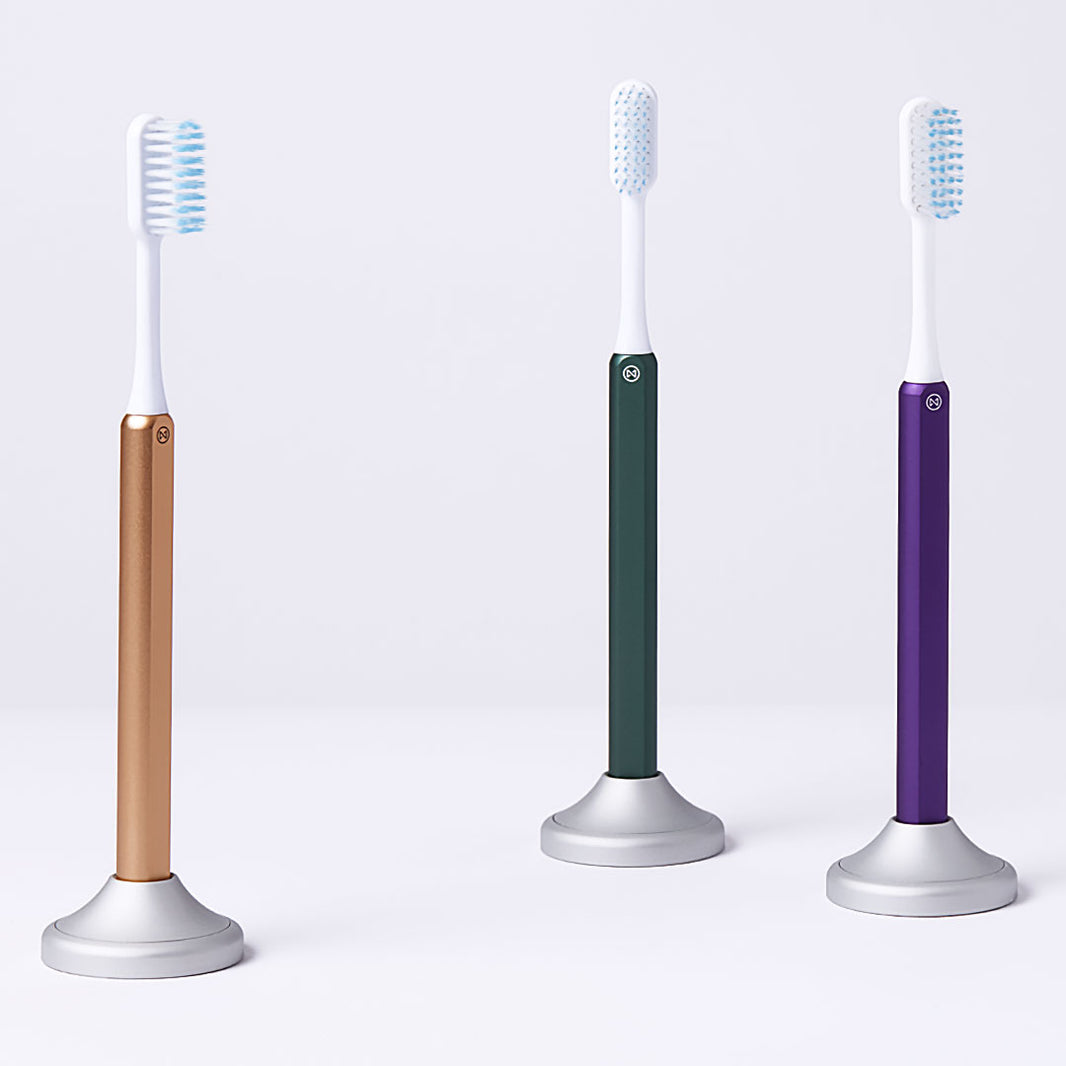 3 Nada toothbrushes in sustainable toothbrush stands