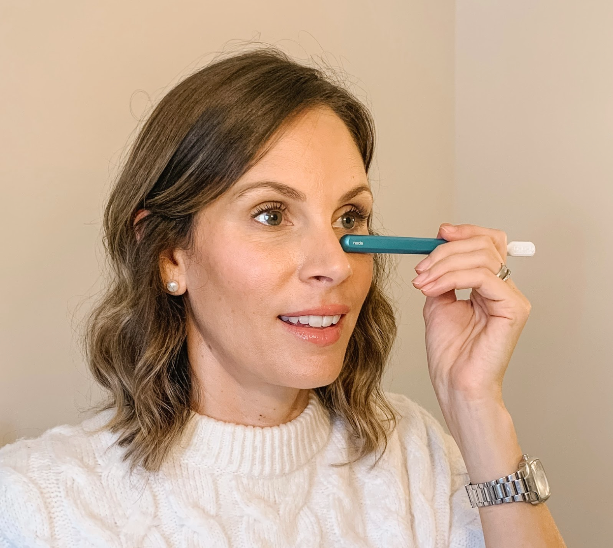 Using Nada toothbrush to apply cold to puffy under eyes