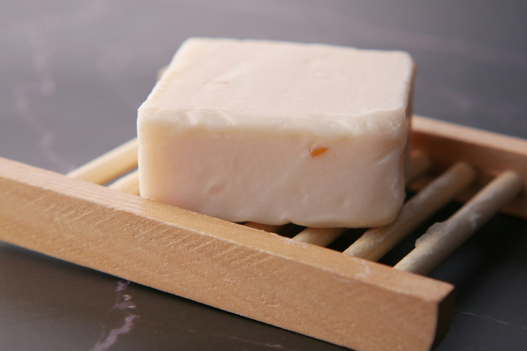 Bar of soap on a wooden soap stand