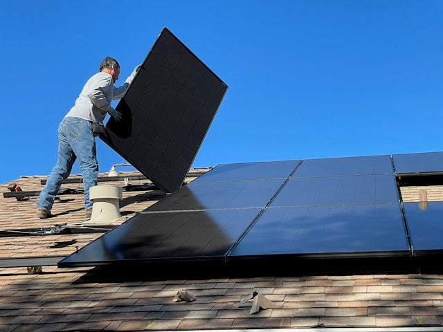 Solar panels being installed on a roof