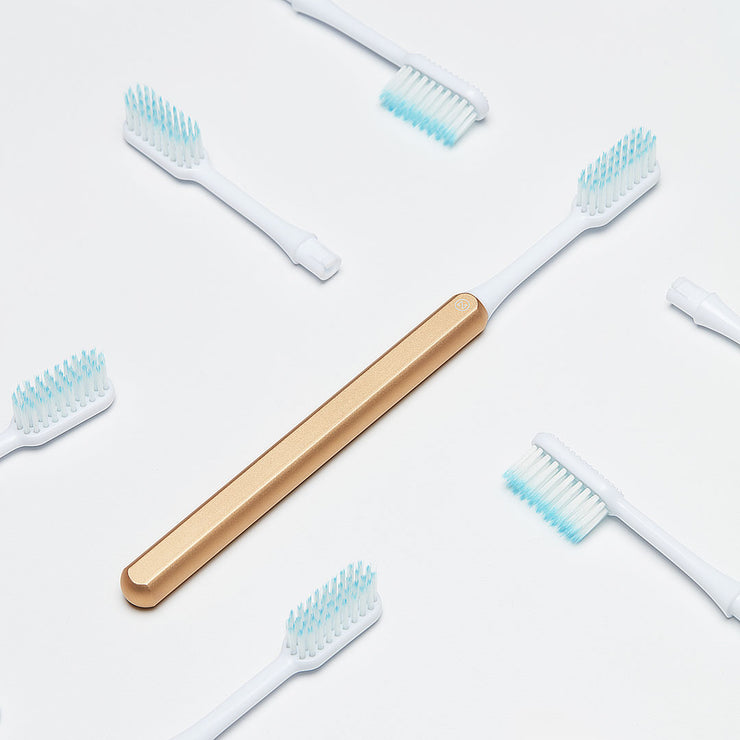 Gold Nada Toothbrush with recyclable toothbrush heads