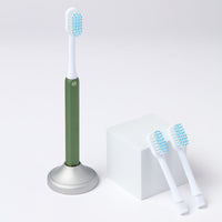 Nada Kids eco-friendly Green toothbrush with a metal handle and recyclable toothbrush heads
