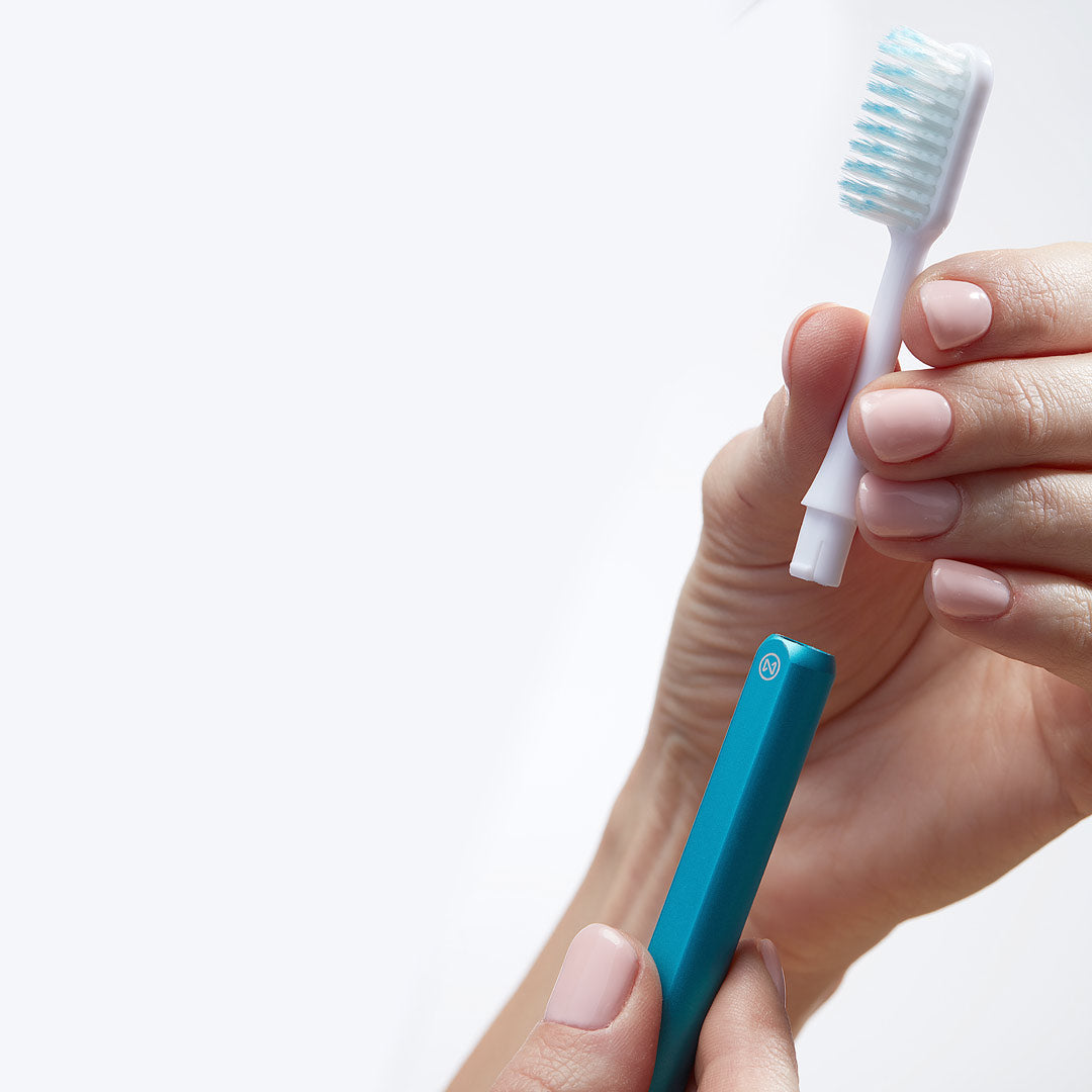 Arctic Blue Nada toothbrush with the recyclable toothbrush head being removed