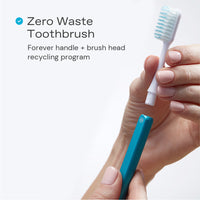 Zero waste Nada Toothbrush with a hand removing the recyclable brush head from the aluminum handle