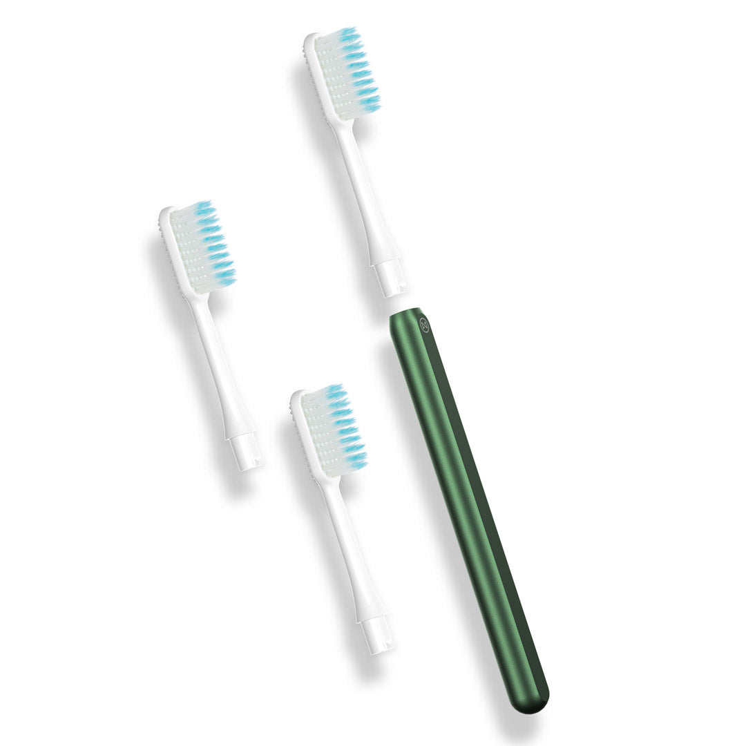 Nada eco-friendly toothbrush with a green metal handle and 3 replacement toothbrush heads