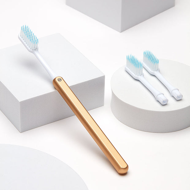 Gold Nada Sustainable Toothbrush with a Metal Handle and Replacement Toothbrush Heads