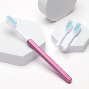 Pink Nada Sustainable Toothbrush with a Metal Handle and Replacement Toothbrush Heads