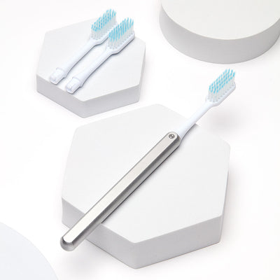 Silver Nada Eco-friendly Toothbrush with a Metal Handle and Replacement Toothbrush Heads